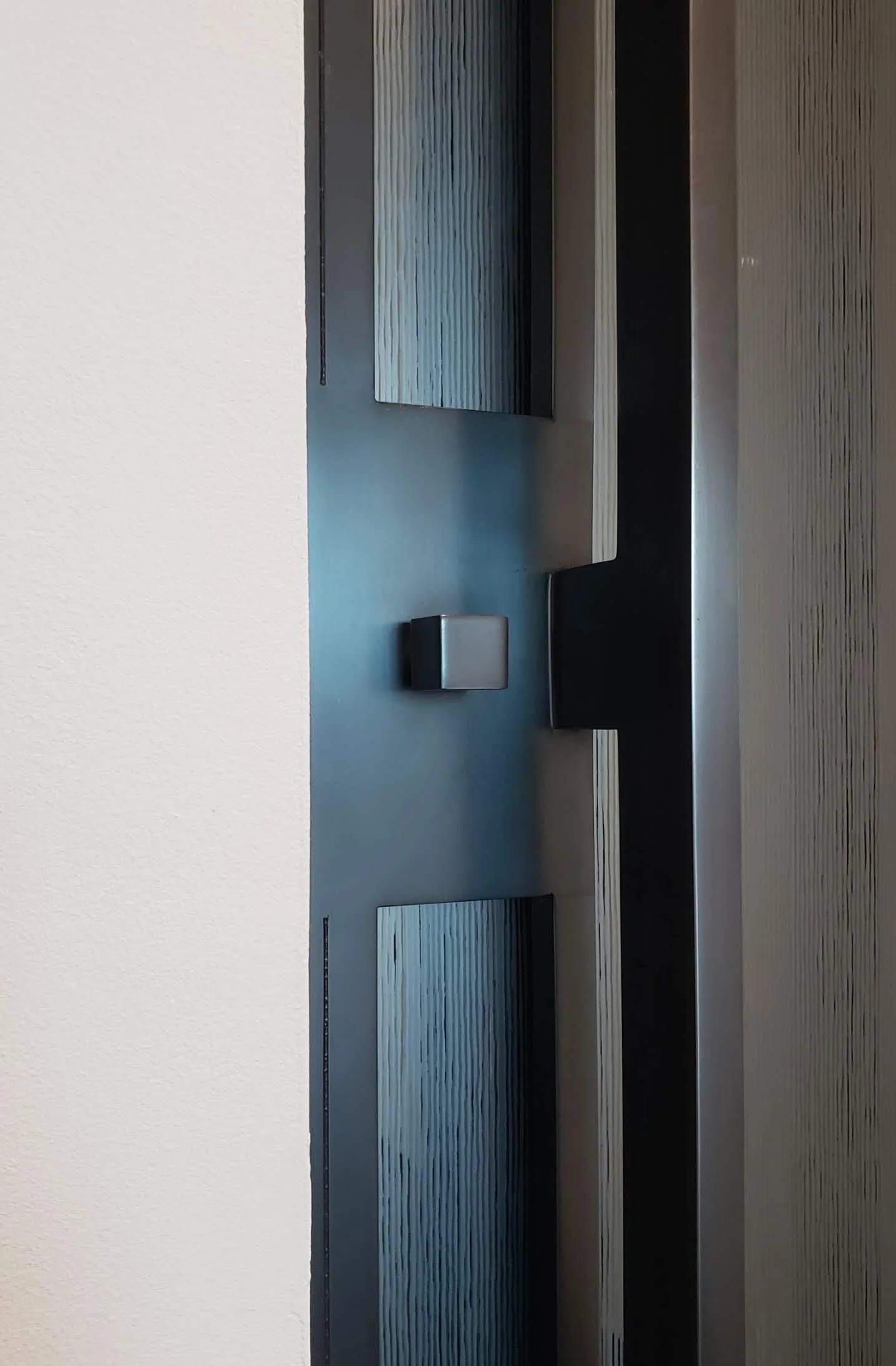 Blackened stainless door pull with a wood inset