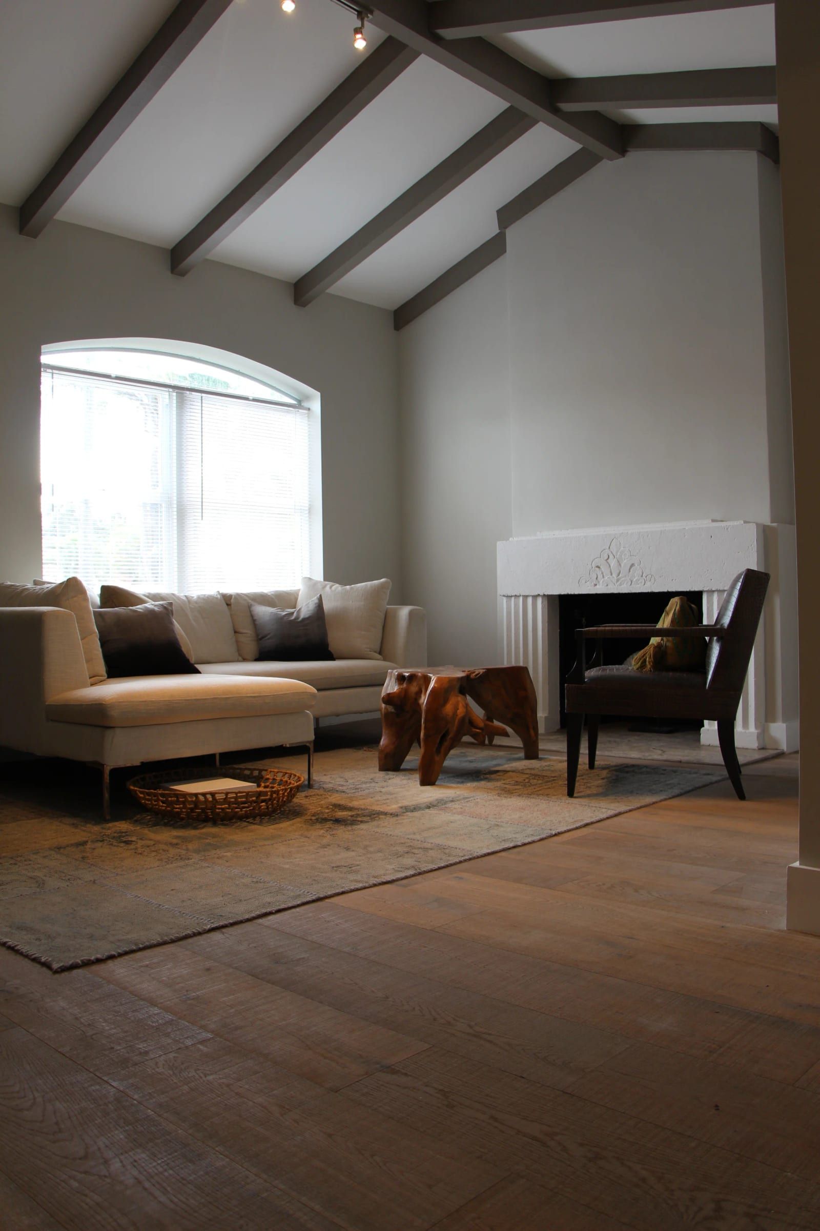 Living room under a vaulted ceiling with exposed beams